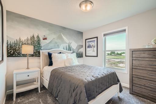 Photo is of the model. One of the secondary bedrooms that comes perfectly sized with a spacious closet.