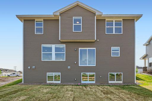 Photo is of the model. Features a look-out basement. Sod included.