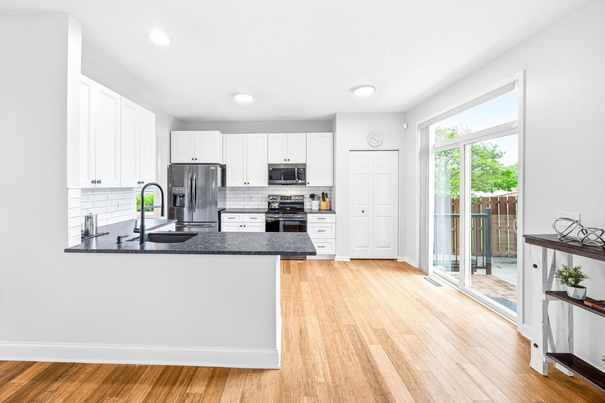 Bright, spacious kitchen and easy to go out to the patio!