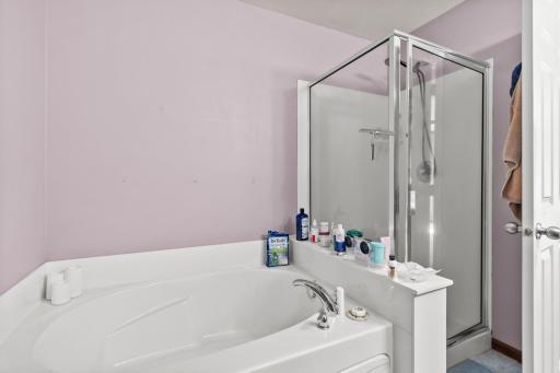 Separate soaking tub and shower.