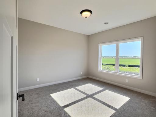The primary bedroom offers private bath with walk in shower and walk in closet with the laundry room conveniently located right outside the door.