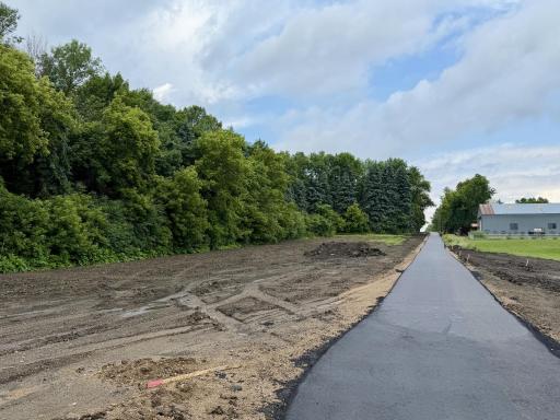 Freshly completed walking path is done. Future community park will be next to the path.