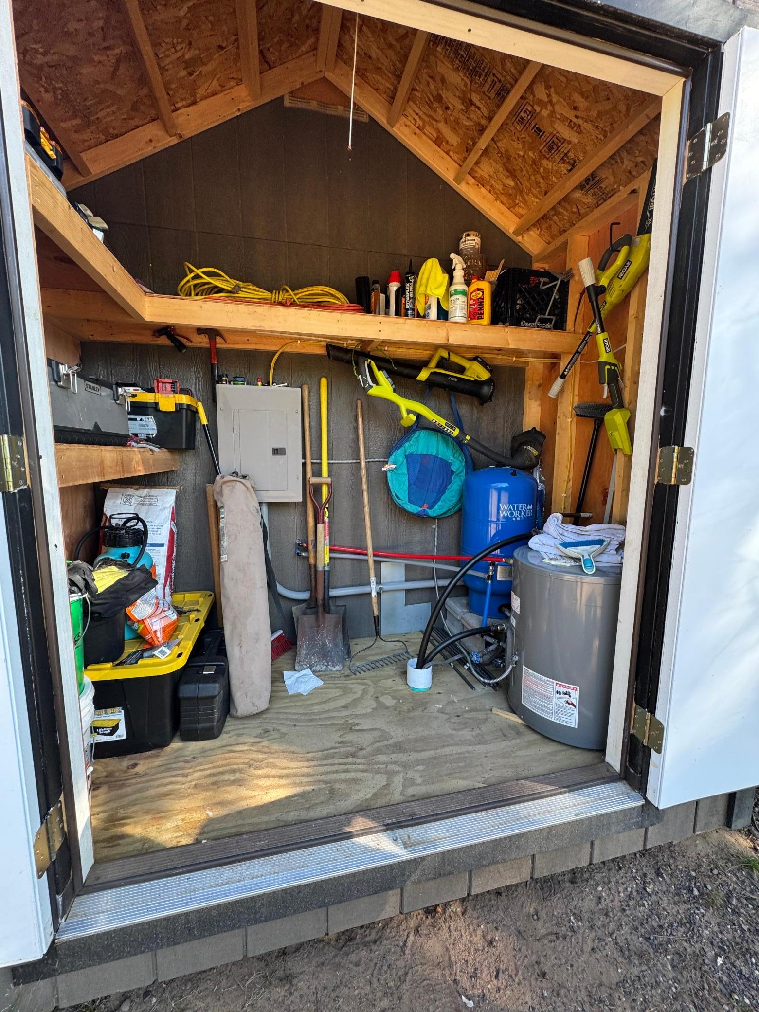 Here is the bunkhouse shed addition with the electric panel, the water heater and lots of storage space.