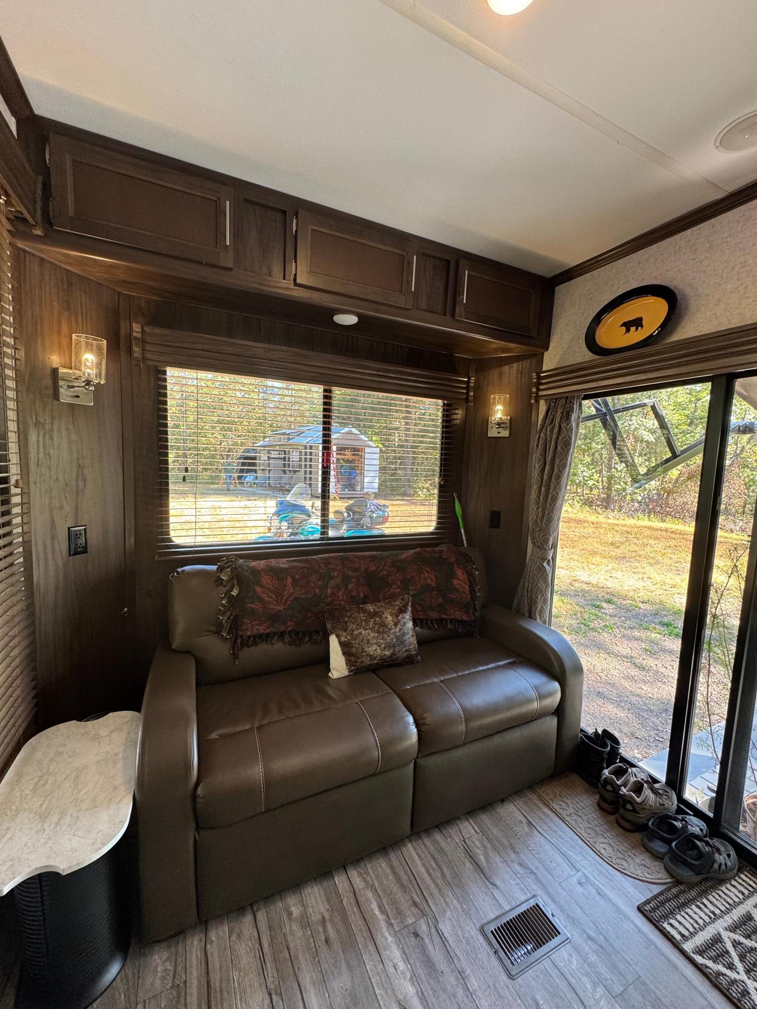 Espresso leather sleeper sofa in the living room.