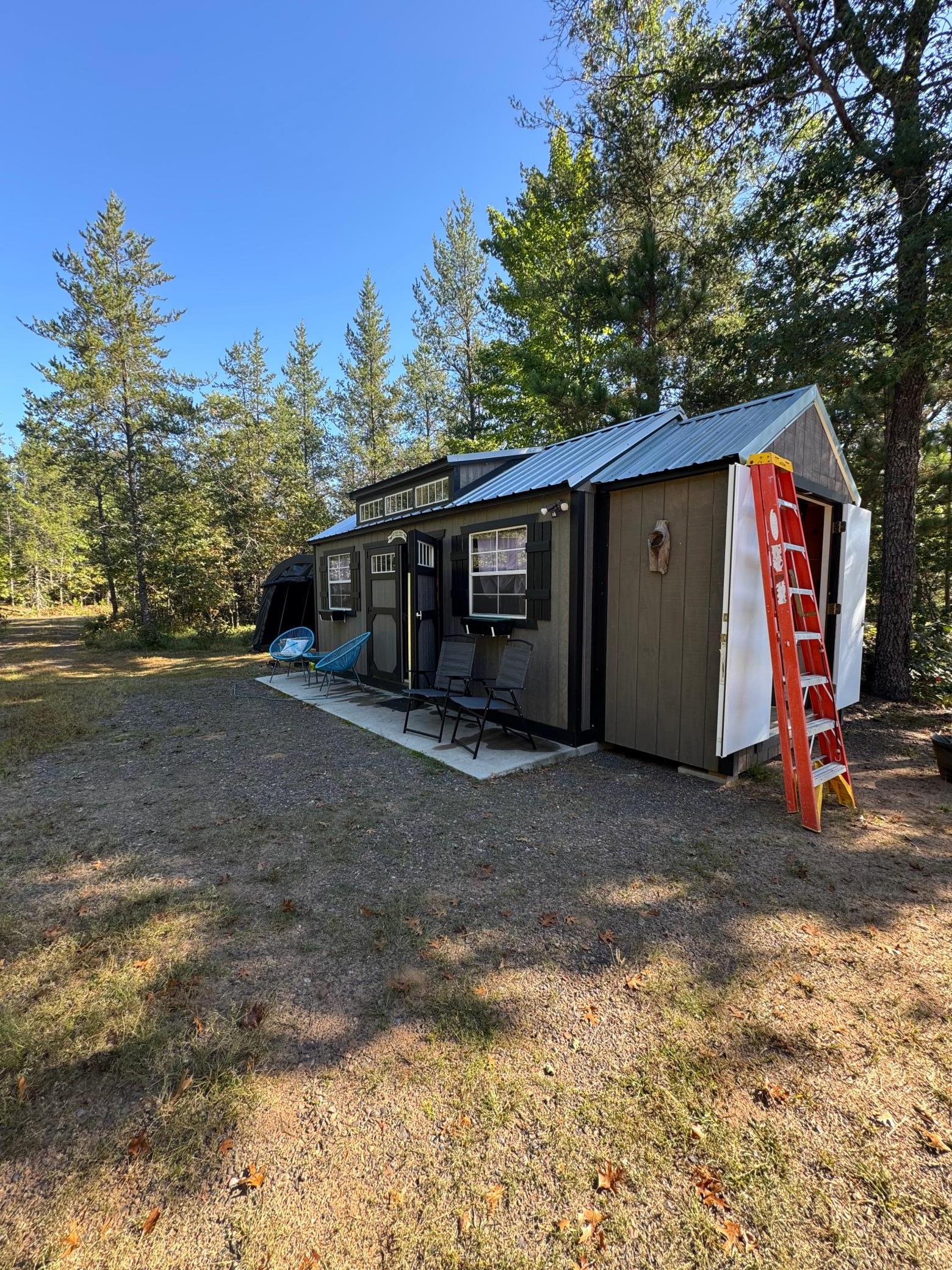 10'x20' Bunkhouse Shed installed a full concurred pad is fully insulated insulting the metal roof.