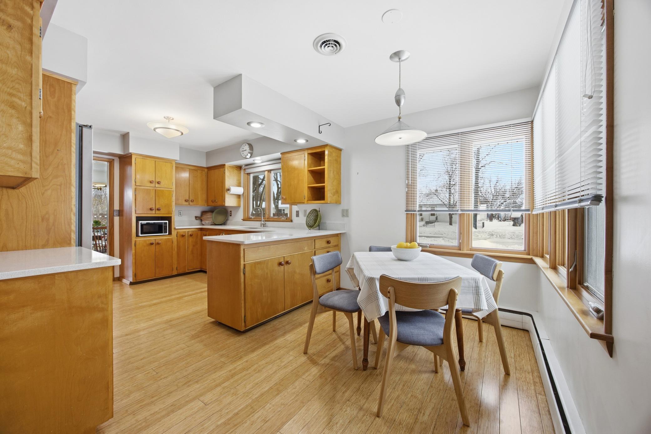 Eat-In Area with unique adjustable height light fixture