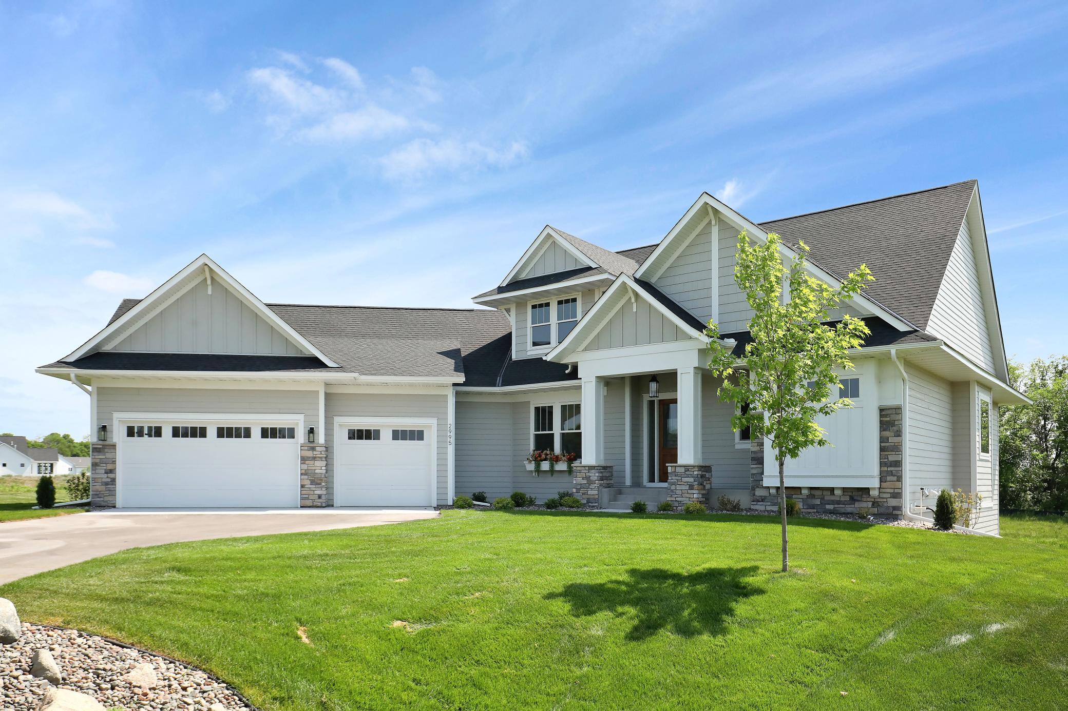 Front of the house, 3-stall garage and covered front porch