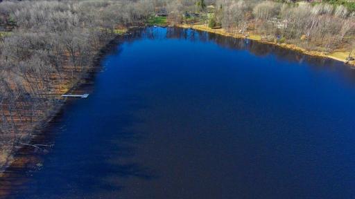 Aerial lake view showcases the privacy, natural beauty, and recreational appeal of this Aitkin lakefront property.