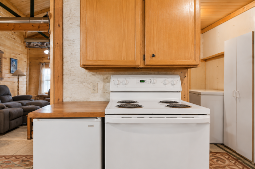 Kitchen appliance area offers practical cooking space for preparing meals before a day on Dogfish Lake or a cozy night in.