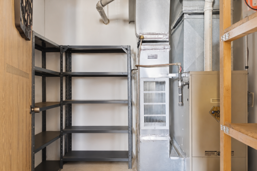 Utility and mechanical area offers helpful storage and access to home systems for easy property maintenance.