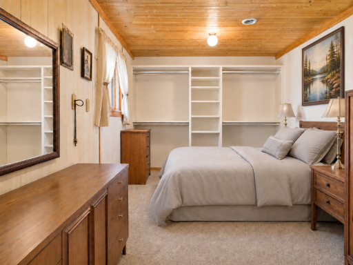 Main bedroom offers a comfortable retreat with clean, neutral finishes and a relaxed cabin atmosphere.