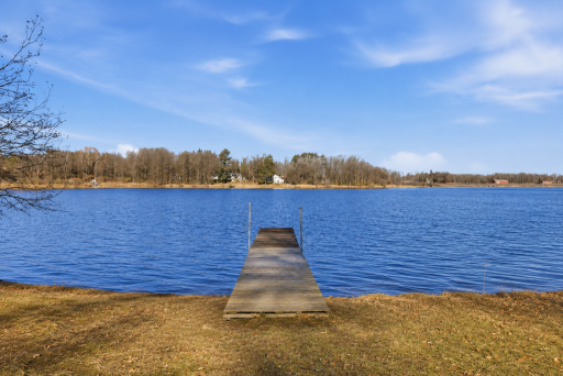 Dock and lake access create the ideal setting for boating, fishing, swimming, and making memories on Dogfish Lake.