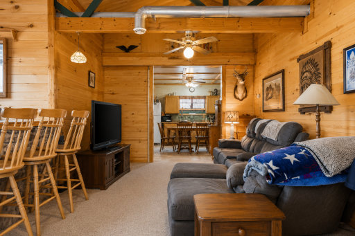 Comfortable main living area offers a welcoming place to unwind after boating, fishing, or enjoying the quiet wooded setting.