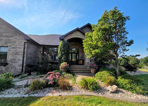 Step up to the front door and enter through the beautiful front foyer.