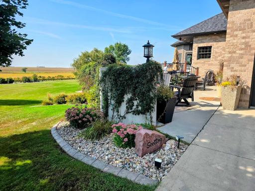 Attractive landscaping throughout the property! SE patio area - welcome to the outdoor kitchen area!