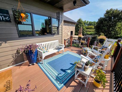 Upper level composite deck-enjoy backyard view in the southern sunshine. Stairs shown to outdoor kitchen area from the main level.