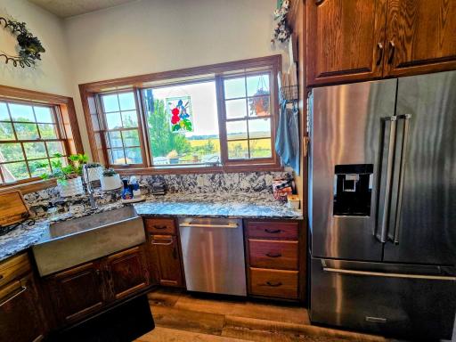 Enjoy the backyard view while working in the kitchen. All kitchen appliances were replaced in 2022.