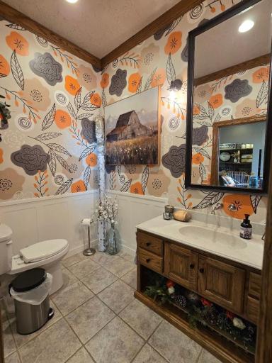 Love this main floor half bath! Custom made wall paper, oak vanity, stool, and onyx tile flooring.