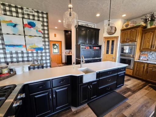 You will love all the extra space with the Cambria Quartz countertop plus a bonus having that extra prep sink while preparing your gormet meal!