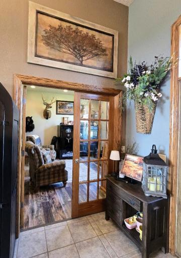 Office area with French doors, could also be used as a bedroom if desired.
