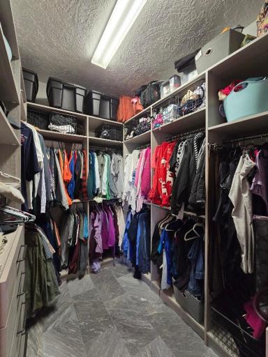 Love this organized closet! Plenty of storage, shelving, drawers, and hanging racks.