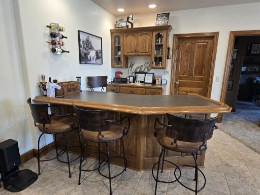 Enjoy a few cold ones around this attractive basement wetbar.