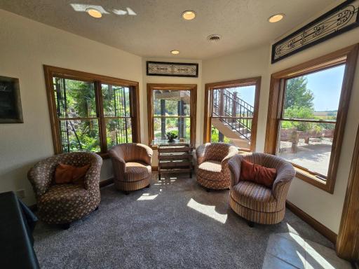Sitting area along the windows by the patio doors. Grab a book!