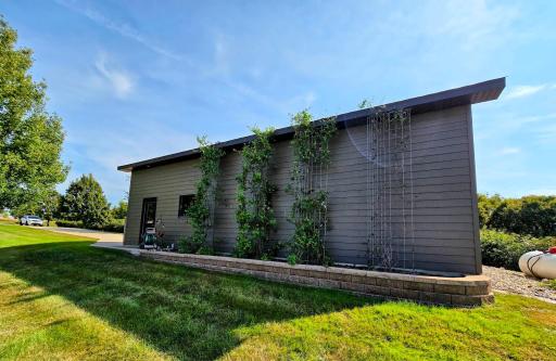West side of the shed showing more extensive landscaping.