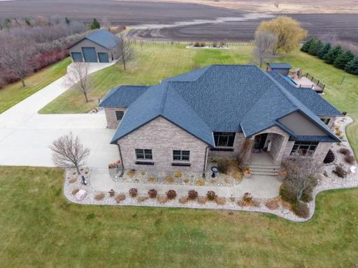 Fall view of property-newer shingles (30 yr/installed 2023) on house & shed.