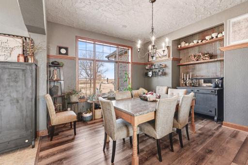 Formal dining room accented with elegant chandelier, perfect for those romatic evening dinners.