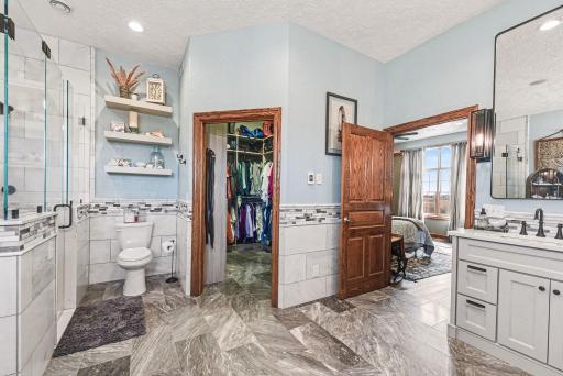 Primary bathroom with spacious walk in closet-convenient built in closet organizer
