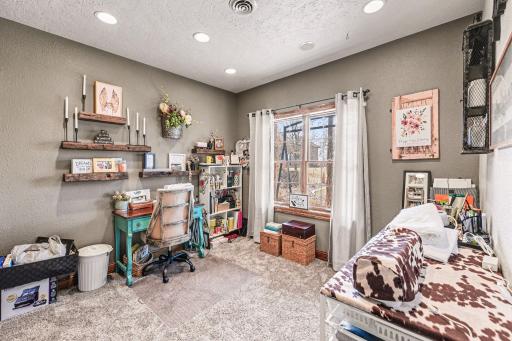 This room is currently used as craft room, but is considered a bedroom.