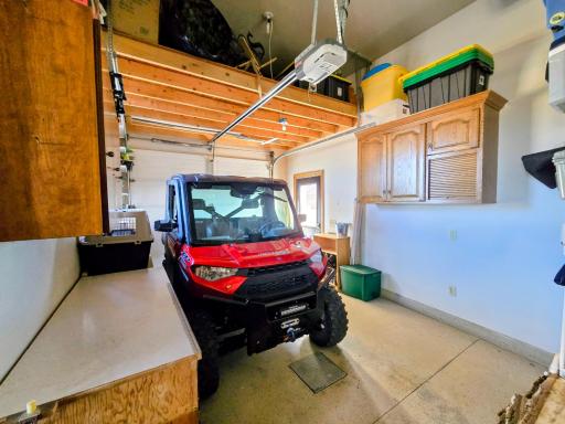 13 x 28 additional 3rd stall garage with additional overhead storage & side door access.