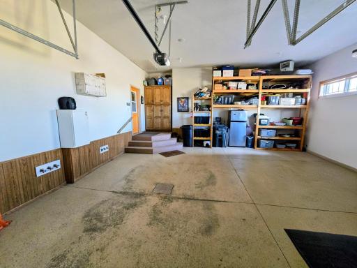 24 x 26 attached garage. Heated & insualted with extra storage shelving and cabinets. Door to mudroom/laundry room.