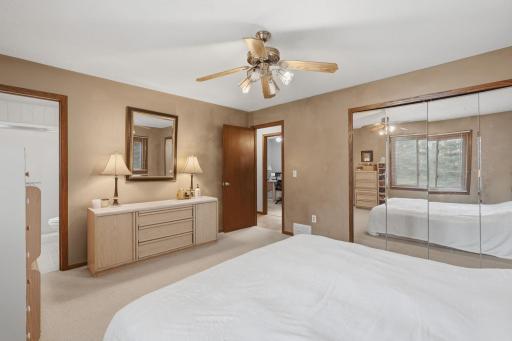 Primary bedroom with large closet with mirror door
