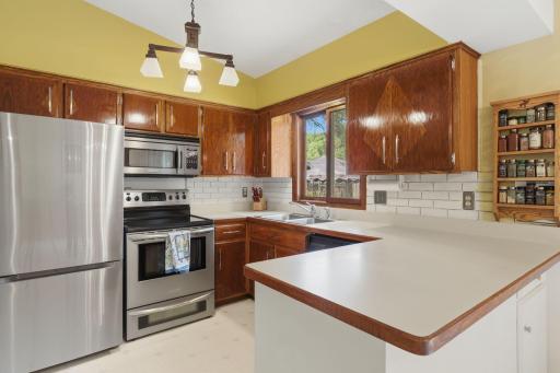 Open kitchen with stainless steel appliances