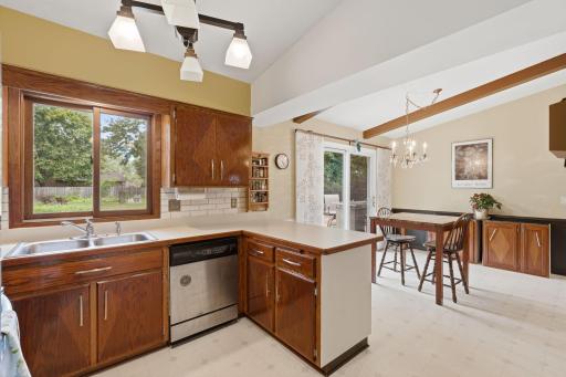 Large kitchen window overlooking backyard