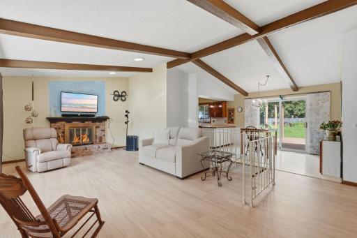 Vaulted ceiling with nice wood beams. Open floor plan.