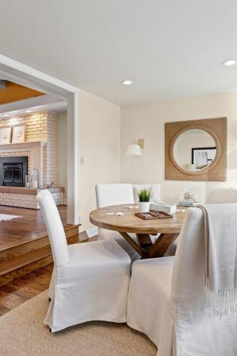 Steps down from the living room is this bright, south facing sunroom