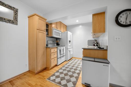 bright functional kitchen, floor to ceiling cabinets