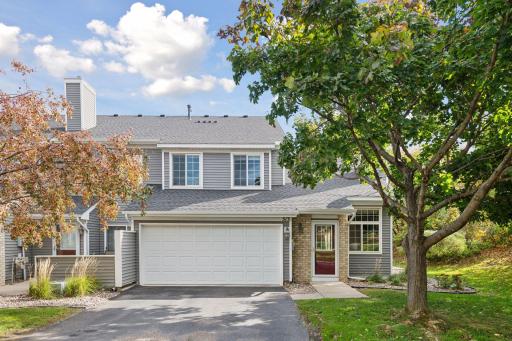 Inviting end-unit townhome with mature trees and private south-west facing views in the Mission Hills neighborhood of Chanhassen