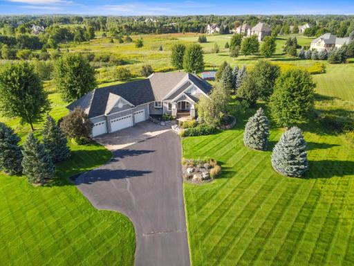 House sits perfectly placed in the land. Beautiful trees throughout.