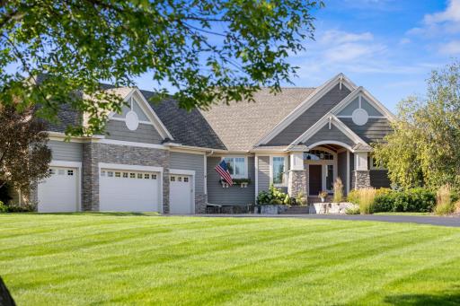 Side angle view of the home. Check out the meticulous landscaping.