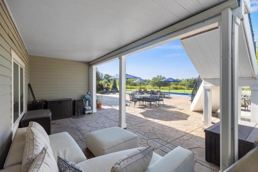 Seating area under the deck! Perfect spot to add a couch or other pool storage or pool toy necessities.