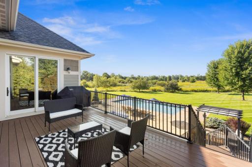 Other angle of the deck with the view of the house. Easy access for hosting and great spot for a grill out!