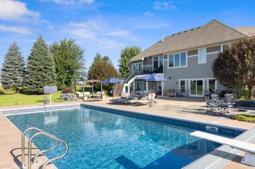 Salt water pool with diving board. Fire pit as well. So many hosting possibilities. Outdoor TV does come with the home. You could watch Sunday football in the pool in the early fall days.