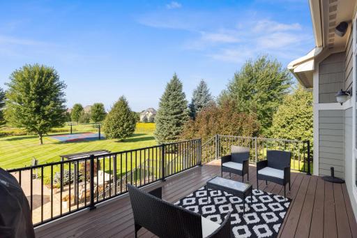 The deck that includes even more views and seating areas for a peaceful morning coffee. Catch a glimpse of the sport court.