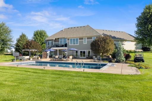 View of the backyard with the pool. Unbelievable views from every angle of this home.