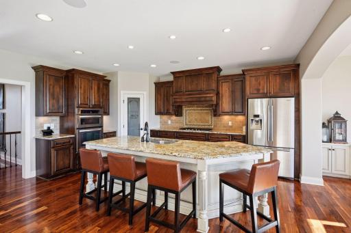 Another angle of the kitchen where there is extra cabinet space featured around the oven and microwave.