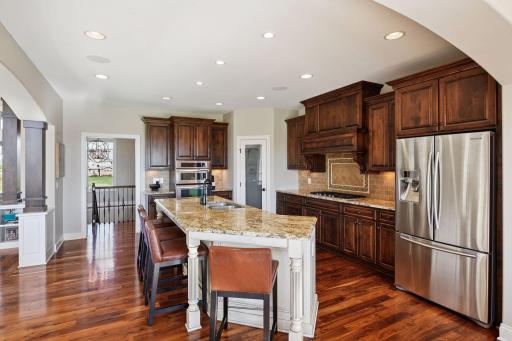 Incredible spacing throughout the home. Plenty of space to gather around the center island.